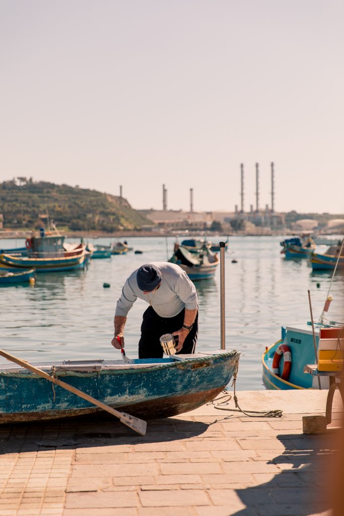 fisherman marsaxlokk fishing harbour in malta